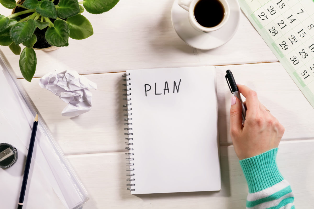 Woman planning with her coffee 